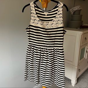 Adorable black and white stripe mini dress with lace. Size M.